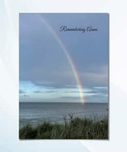 Personalised rainbow memorial card with rainbow over ocean cover design