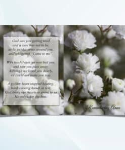 Unfolded white flowers memorial card showing full front and back floral design